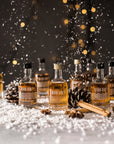 Devon Rum Co Miniatures in a festive scene with snow falling.