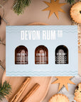 Devon Rum Co Miniature Bottles in a gift set with a festive backdrop.