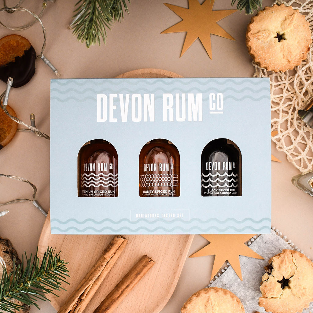 Devon Rum Co Miniature Bottles in a gift set with a festive backdrop.