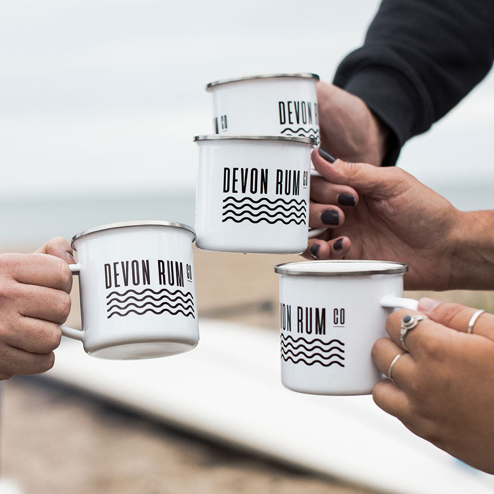 Devon Rum Company Enamel Mugs on the Beach