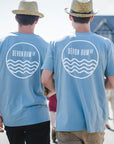 Two men wearing blue fitted organic cotton t-shirts by the Devon Rum Company